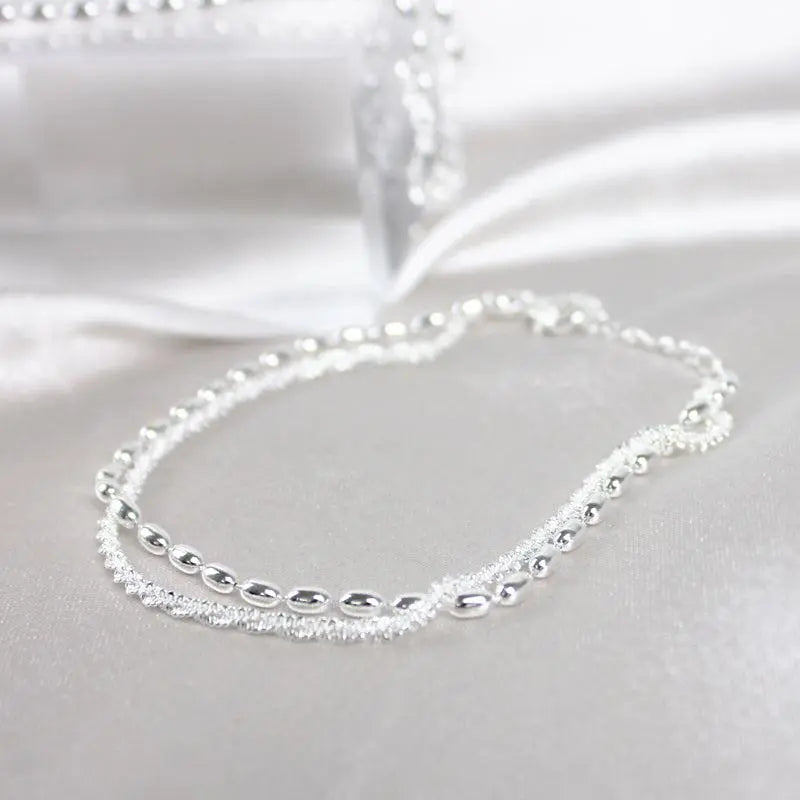 Set di bracciali eleganti in argento con pietre di zirconia